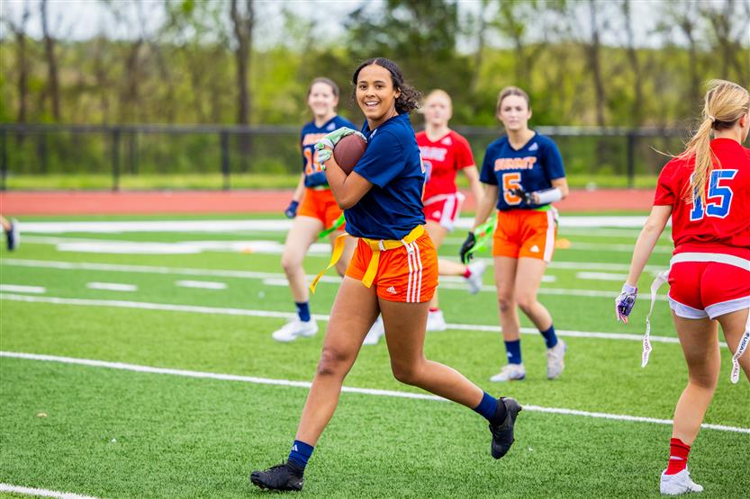 Students play flag football
